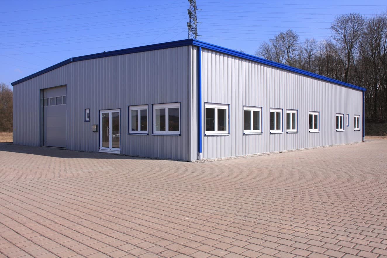 FactorySteelOverstock metal building with blue trim